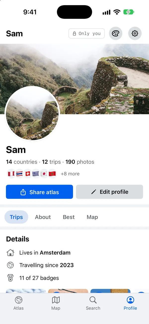 Sam’s Profile in Wall: a cover photo, a large portrait, a row of flags, and details: lives in Amsterdam, travelling since 2023.